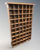 A sheesham wood pidgeon hole shelf, 100 cm x 21 cm x 154 cm.