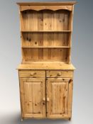 A modern pine dresser, 85 cm x 46 cm x 182 cm.