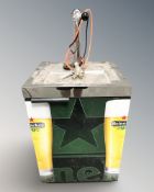 A commercial drinks dispenser with Heineken branding ,