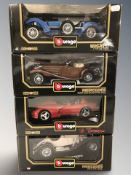 Four Bburago 1/18 and 1/19 scale die cast cars, in boxes.