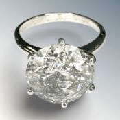 A diamond solitaire ring, the brilliant-cut stone weighing 6.