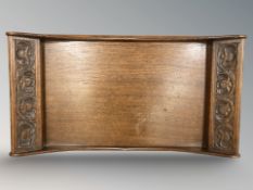 An Arts and Crafts carved oak twin handled serving tray by Arthur W Simpson 'The Handicrafts',