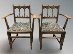 A pair of reproduction oak armchairs