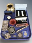 A Halcyon Days enameled pill box, in box, together with other items including an desk blotter,