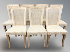 A set of seven rattan dining chairs