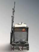 A Soundcity amplifier, a JVC amplifier, three further separates and a pair of microphone tripods.