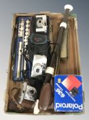 A Rosehill chrome flute, in case, a large Yamaha recorder, Kodak Retinet camera, Polaroid camera,