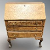 An Edwardian oak fall front bureau,