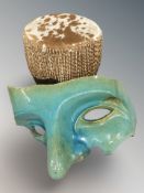 A hide covered drum and a large pottery mask fragment, width 50 cm.