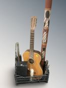 An acoustic guitar, a didgeridoo, various music stands, etc.