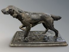 A resin figure of a setter on ceramic plinth,