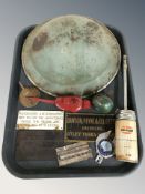 An enameled metal helmet, group of oil cans, several metal plaques, etc.