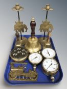 Brass wares including a pair of candlesticks decorated with elephants, three various school bells,