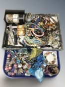 An assortment of modern costume jewellery, various bead necklaces, bangles, wristwatches,
