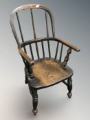 A 19th century child's elm Windsor armchair,