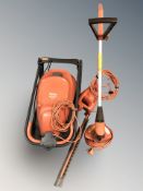 A Flymo electric lawnmower, a hedge trimmer and a strimmer.