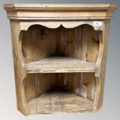 A rustic pine hanging corner wall shelf, height 62 cm.