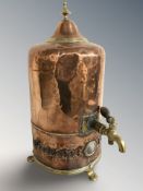 A copper and brass water boiler, height 49 cm.