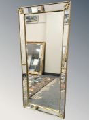 A gilt framed rectangular mirror, 115 cm x 53 cm.