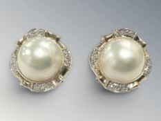 A pair of 18ct gold and diamond mabe pearl earrings, each 22mm diameter.