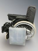A folding wheelchair.