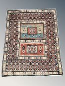 A Caucasian rug, 154 cm x 123 cm.