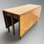 A 19th century mahogany drop leaf dining table,