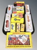 A group of Atlas Editions Dinky die cast vehicles including trucks, loaders, fire engine, etc.