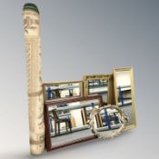 A contemporary machine made carpet and a group of mirrors.