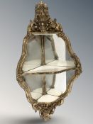 A 19th century Rococo gilt wood three-tiered corner wall mirror, height 84 cm.