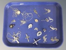 A small selection of silver jewellery including lockets, crucifixes, necklaces, etc.