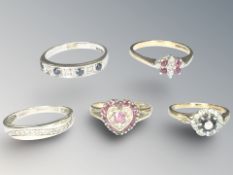 Five 9ct gold rings set with diamonds,
