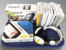 A Nintendo 2DS console, further 3DS XL console, in boxes, several games, headphones.