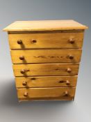 A modern pine four drawer chest, 74 cm x 47 cm x 93 cm.