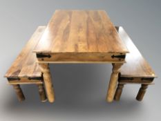 A John Lewis sheesham wood dining table and matching pair of low benches,