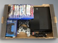 A Sony Playstation 4, with lead, two controllers, various games, etc.