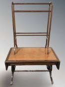 A reproduction mahogany drop leaf coffee table and a towel rail