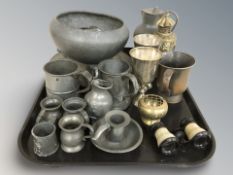 A group of 18th/19th century pewter wares including tankards, a hammered tripod bowl, plates,