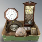 A group of antique and later wall and mantel clocks.