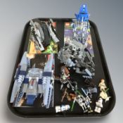 A group of assembled Lego Star Wars models and figurines