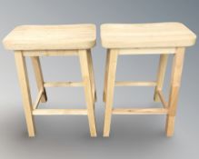 A pair of modern pine stools, height 61 cm.