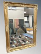 A gilt framed rectangular mirror, 104 cm x 75 cm.