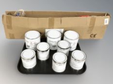 Eight various tins of metal priming paint and a garden strimmer.