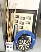 A group of snooker cues, dart board, various pictures removed from a pub, sets of snooker balls.