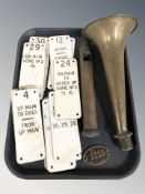 A group of industrial signs, brass horn, etc.