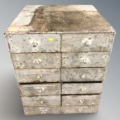 An industrial enameled metal twelve drawer chest, 58 cm x 58 cm x 72 cm.