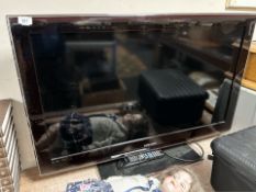 A Samsung 40 inch LCD TV with lead and remote