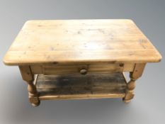 A modern pine two tier coffee table, fitted a drawer, width 91 cm.