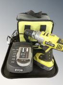 A Ryobi power drill, battery pack, charger,