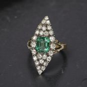 A fine quality antique diamond and simulated emerald ring in a marquise-shaped setting, size N½.